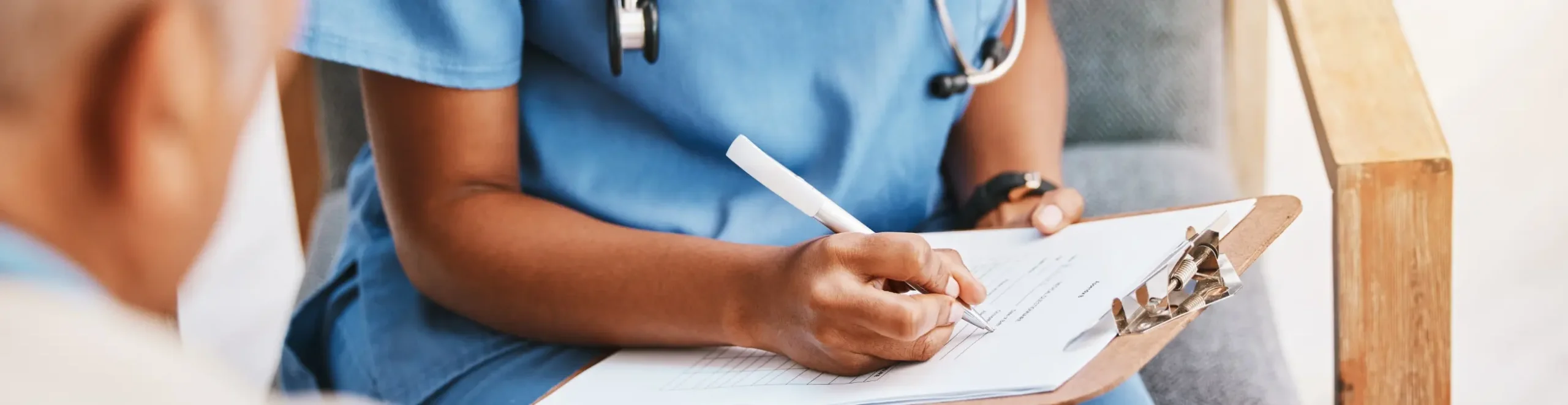 Nurse writing checklist