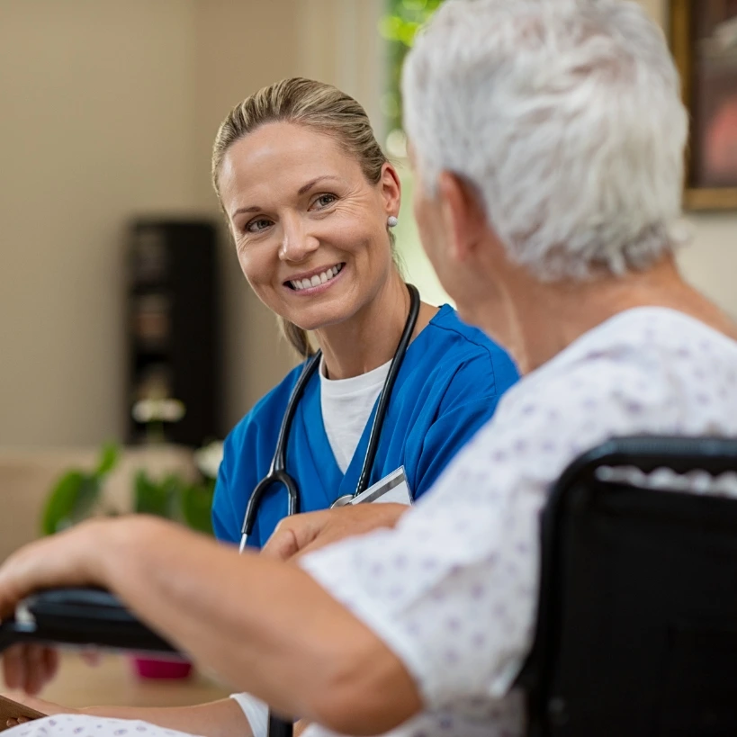 Nurse with patient in chair